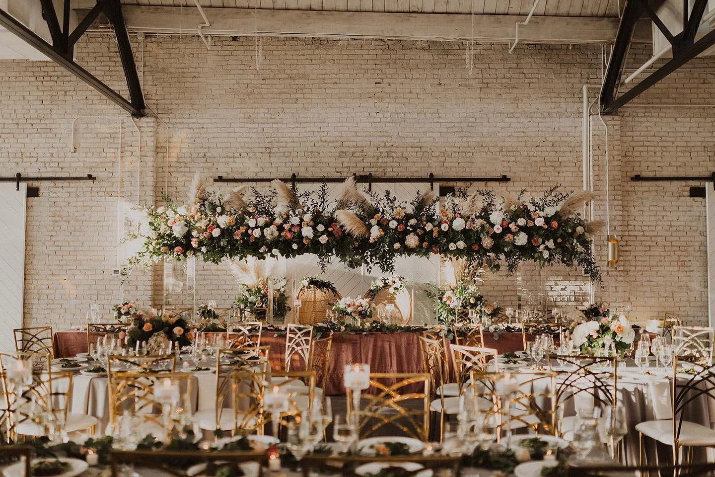 A Brancato&rsquo;s Catering reception &mdash; florals, gold chiavari chairs, and a fully styled head table